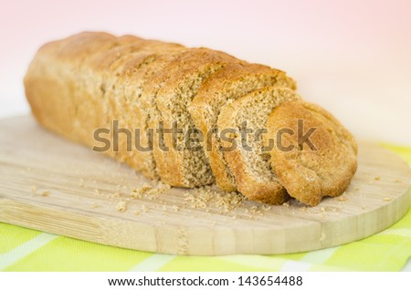 Fresh white loaf of bread, square loaf. Loaf of sliced bread baking delicious