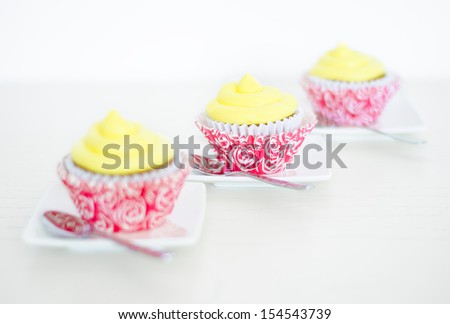 Cupcakes. Three cupcakes on white background, selective focus