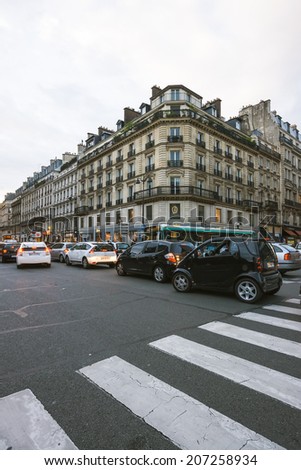 PARIS; FRANCE-OCTOBER 4; 2010: evening traffic on Rue de Rivoli on October 4; 2010 in Paris. Rue de Rivoli is one of the most famous commercial streets of Paris; is situated in the centre of the city.