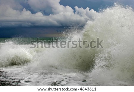 Storm on the sea with high waves under the sky with thunderclouds