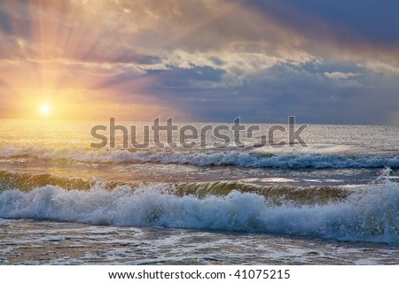 Storm on the sea with waves under the sky with thunderclouds