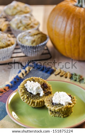 A traditional fall food, fresh baked pumpkin muffins are served with whipped cream cheese.