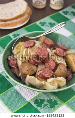Slow cooked cabbage, potatoes & smoked sausage with bread