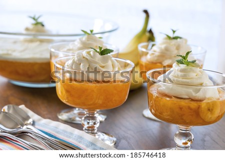 Old fashioned orange pineapple jell-o dessert with a creamy whipped topping.  Selective focus was used on this image.