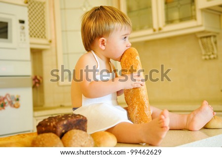 little boy eating bread