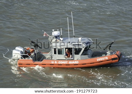 NEW YORK - APRIL 19: A small U.S. Coast Guard boat patrols the Hudson River in New York City. Photograph taken April 19, 2008.