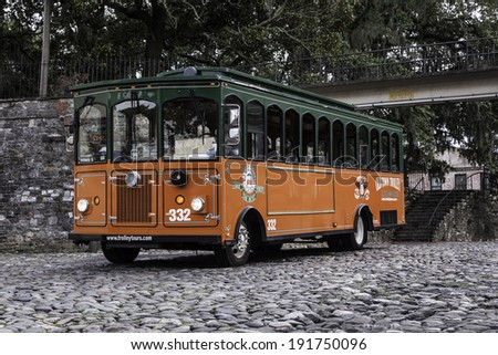 SAVANNAH, GA - JULY 21:  A trolley is parked on the cobblestone riverfront in Savannah Georgia\'s historic district.  Photo taken July 21, 2013.