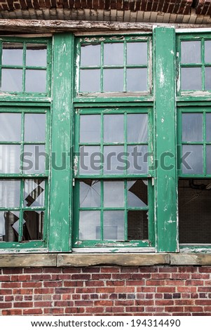 An old building is in ruins;  broken window; horizontal format
