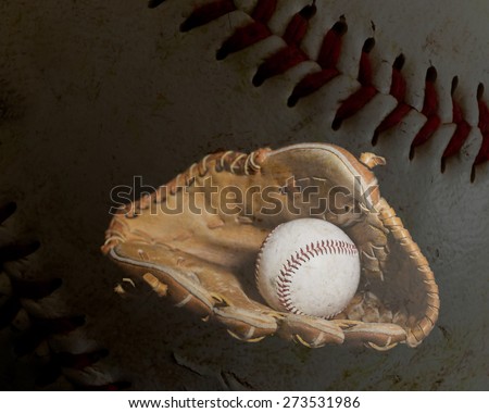 A worn baseball sits inside an old baseball glove with the leather and stiching of a ball in the background.  Image was lit by using a lightpainting technique.