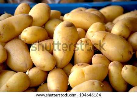 New and clear potatoes on a weekly market