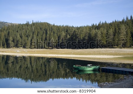 Two boats on the mole of the lake