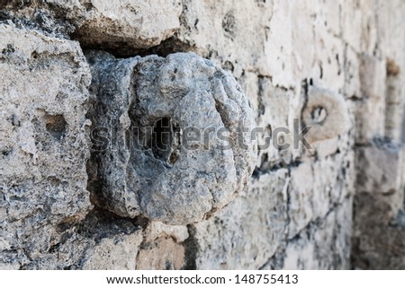 Stone rings in wall of salt museum (Trapani, Italy)