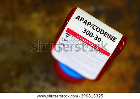 Codeine prescription bottle with warning label. Codeine is a narcotic analgesic (pain reliever).
