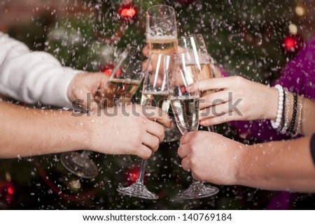 Christmas New Year\'s toast on the background of the Christmas tree in snow