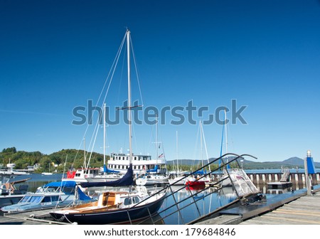 Newport, Vermont, USA - September 18, 2013: Sailboats line the town pier on this beautiful sailing day in early autumn.