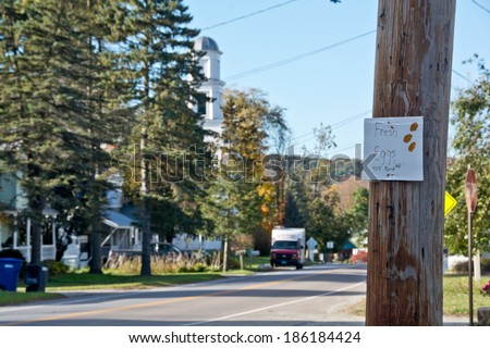 Huntington, VT, USA - October 10, 2013: A local resident advertises fresh eggs with a sign tacked to a telephone pole on Main Street on this sunny autumn afternoon.