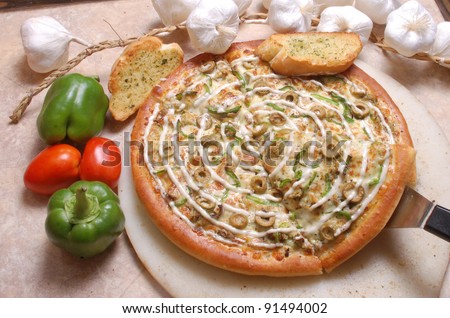 Pizza with loads of toppings and extra cheese