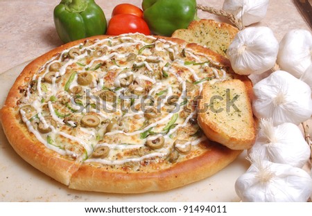 Pizza with loads of toppings and extra cheese