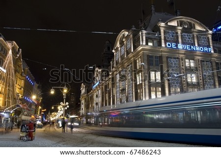 Christmas time Amsterdam night-shot snow landscape city-lights vintage-look netherlands holland night darkness tripod dam-square tram public-transport