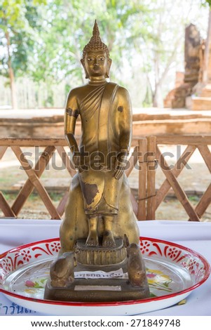 Attitude or Posture of the old golden Buddha in Thai Temple: Seated for Wednesday Night.