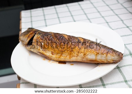 Saba fish grill serve on white dish ready to eat.