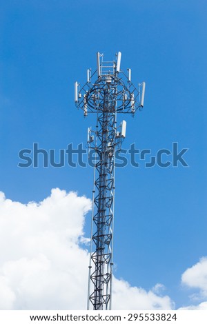 Cell site, Telecommunications radio tower or mobile phone base station with cloud and blue sky background