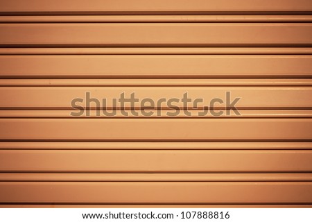 Cool industrial metal orange door background with dark corners