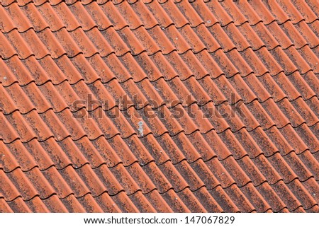 Old red roof tiles background details