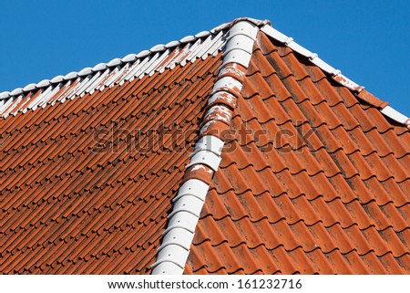 Red roof tiles background details with sky