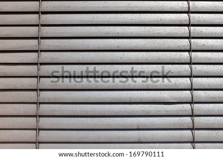grey shutters over a shop window - texture
