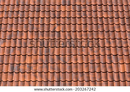 Red tiles roof background texture of a house