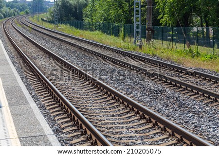 Railway lines travel through a railway station