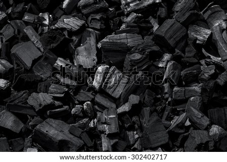 Coal mineral black as a cube stone background