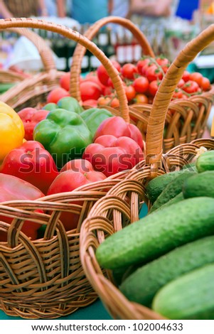 At the market. Basket with free vegetables .