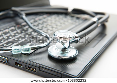 Concept of diagnostic. Stethoscope and laptop