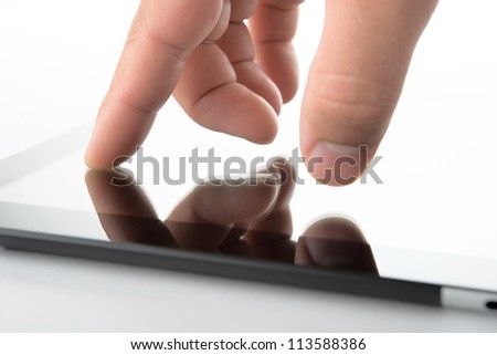 close view of hand on contemporary tablet pc