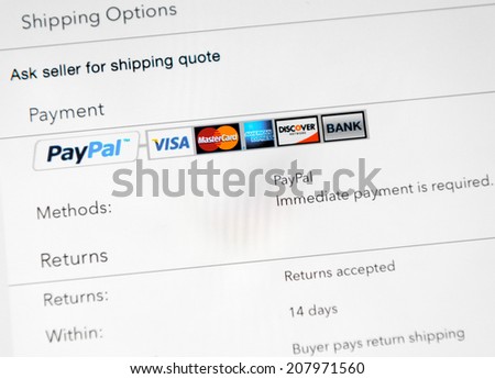 Simferopol, Russia - July 29, 2014: Photo of a Apple iPad device showing online shopping process via Paypal, using popular banking systems Visa, Mastercard and other.