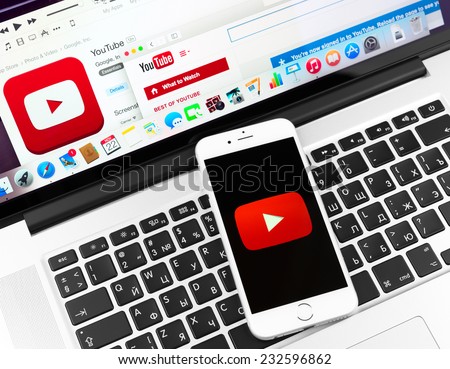 SIMFEROPOL, RUSSIA - NOVEMBER 22, 2014:  Youtube icon on Apple iPhone 6 and Macbook display. YouTube is the popular online video-sharing website, founded in February 14, 2005