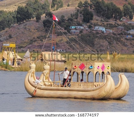LAKE TITICACA, PERU - MAY 20: Indians sail by the handmade boat to Uros island on Lake Titicaca on May 20, 2013, Peru.
