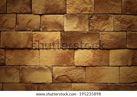 Brown wall made from big bricks.