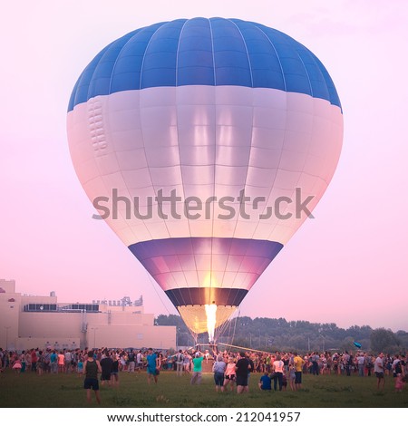 RJAZAN, RUSSIA - AUGUST 15: Preparation for Hot Air Balloon festival with night glow on August 15, 2014 in Rjazan, Russia.