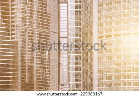 Walls of the buildings in the business city center at sunrise time.