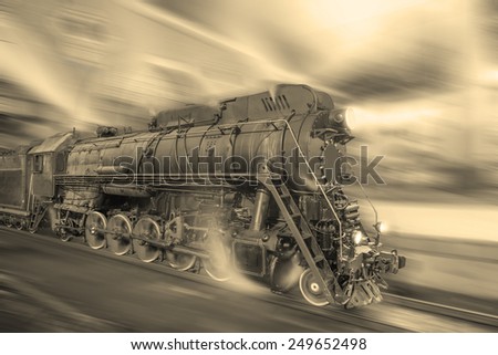 Steam train goes fast on the night station background. Vintage style image.