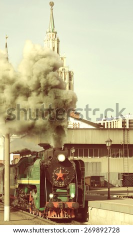 Departure of the retro passenger steam train. Vintage image.
