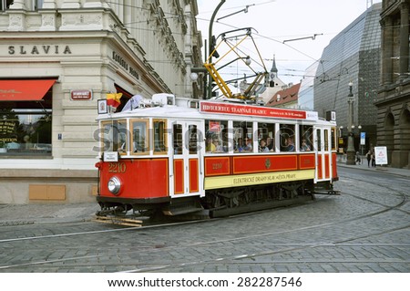 PRAGUE, CZECH REPUBLIC - JUNE 25, 2010: Vintage excursion tram goes on the central city street, Czech Republic, June 25, 2010.