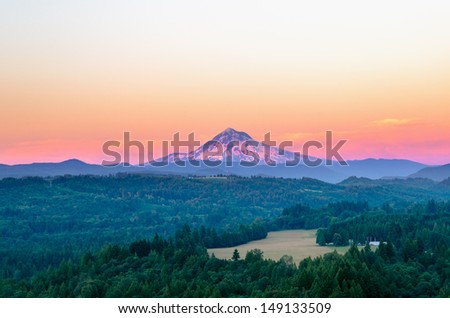 Mount Hood at sunset with a purple glow