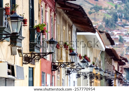 Colonial facades and rows of street lights in Cajamarca, Peru