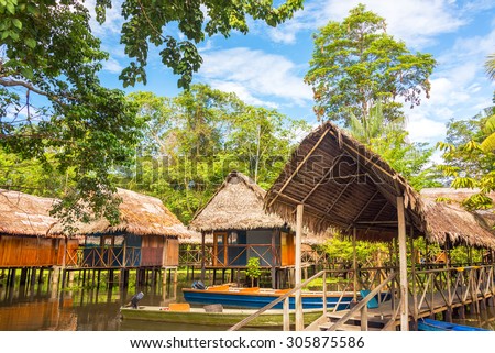 Jungle shacks on stilts in the Amazon rain forest near Iquitos, Peru