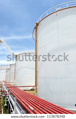 oil Tank farm a large, white color and Blue sky.