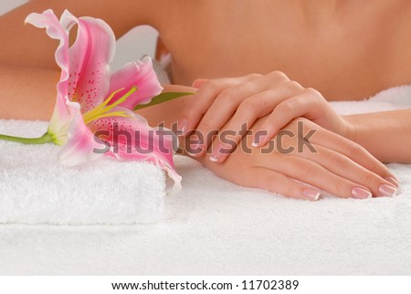 Studio nail - woman\'s hands on white towel